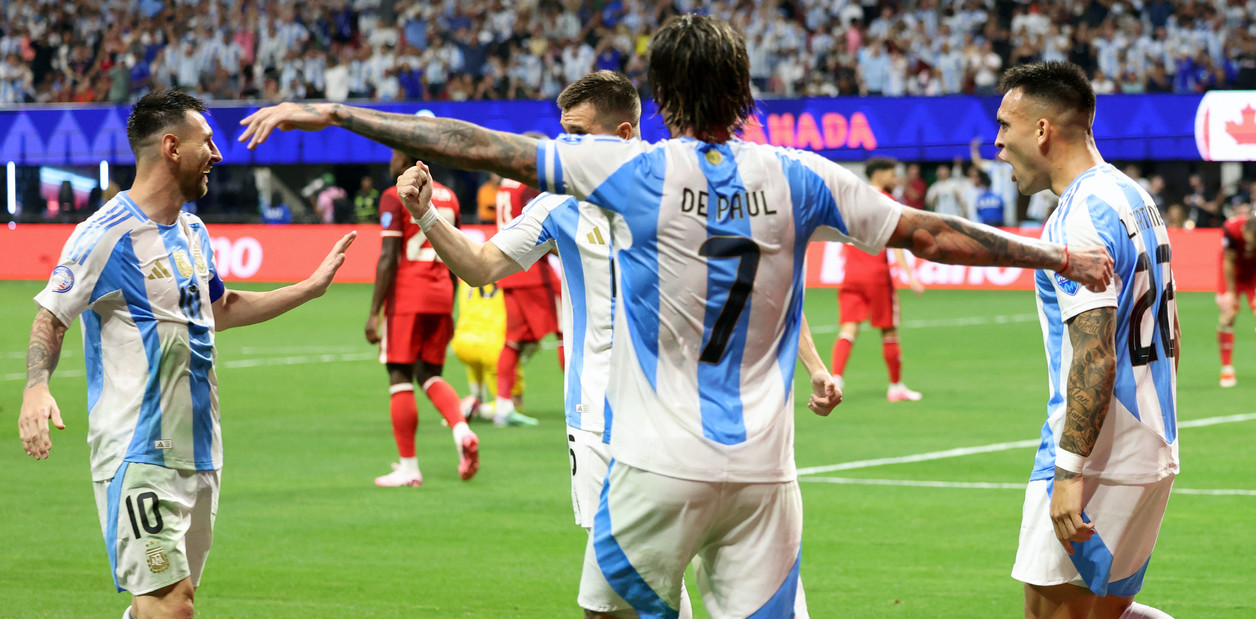 Argentina's forward #22 Lautaro Martinez (R) celebrates scoring his team's second goal with Argentina's forward #10 Lionel Messi (L) and Argentina's midfielder #07 Rodrigo De Paul (C) during the Conmebol 2024 Copa America tournament group A football match between Argentina and Canada at Mercedes Benz Stadium in Atlanta, Georgia, on June 20, 2024. (Photo by CHARLY TRIBALLEAU / AFP)